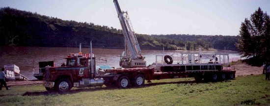 Unloading rivers rafts for Klondike Days